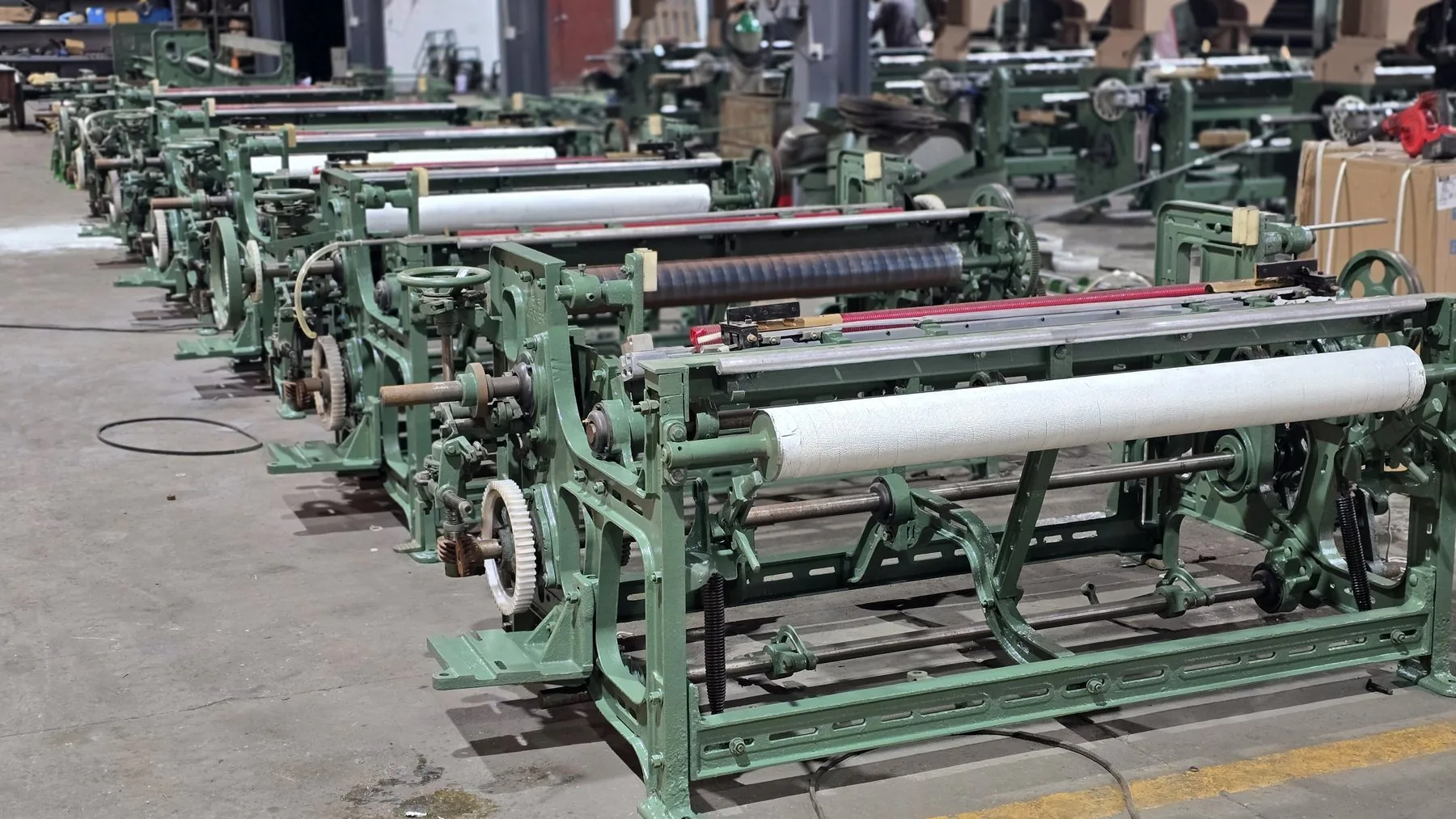 MG768 looms arranged in a factory workshop row
