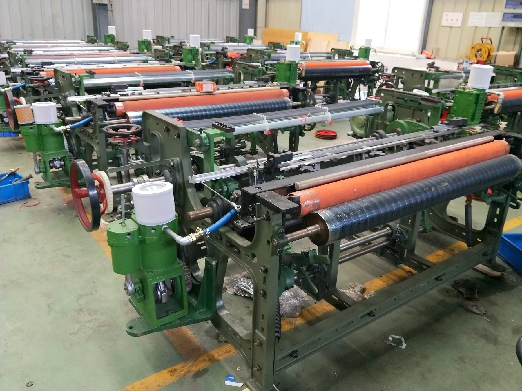 MG768 machines in batch assembly inside workshop